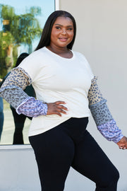 Heimish Full Size Animal Print Ruffle Trim Top
