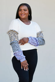 Heimish Full Size Animal Print Ruffle Trim Top