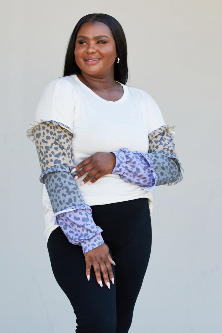Heimish Full Size Animal Print Ruffle Trim Top