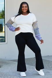 Heimish Full Size Animal Print Ruffle Trim Top