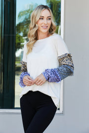 Heimish Full Size Animal Print Ruffle Trim Top