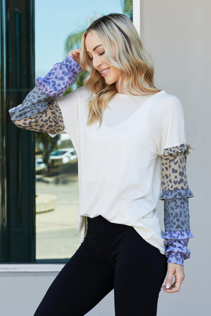 Heimish Full Size Animal Print Ruffle Trim Top