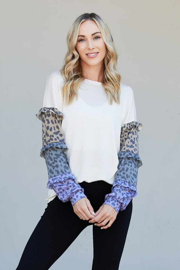 Heimish Full Size Animal Print Ruffle Trim Top
