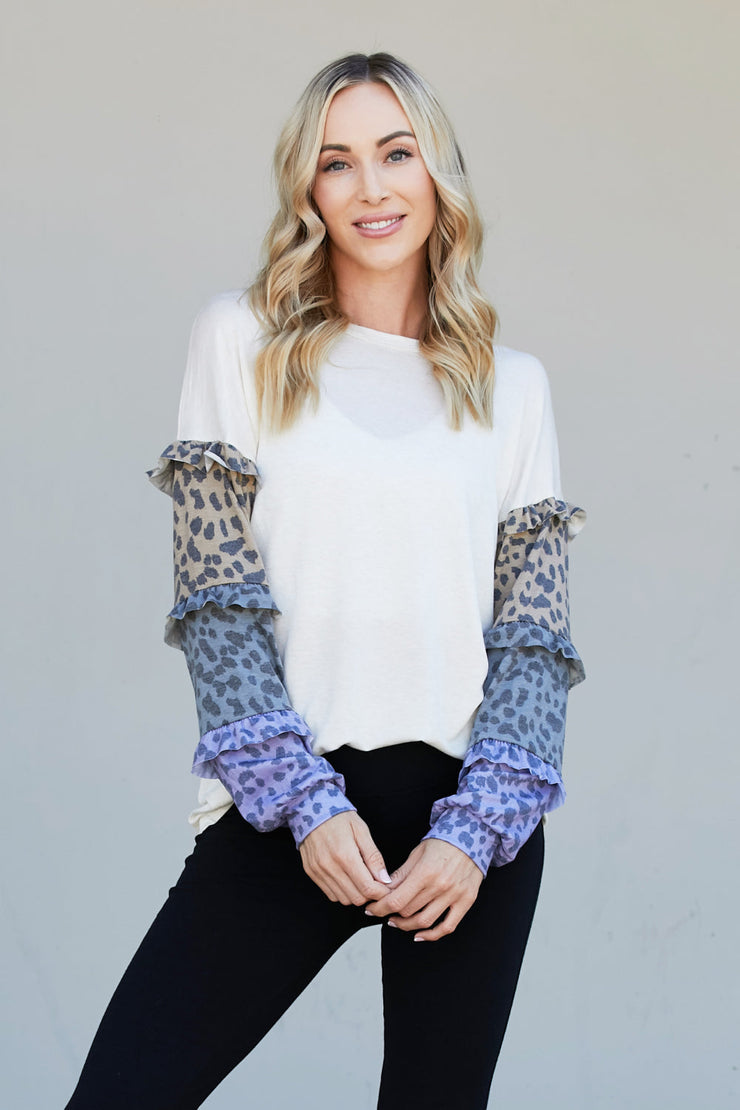Heimish Full Size Animal Print Ruffle Trim Top